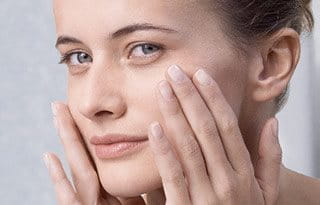 Woman applying sun protection