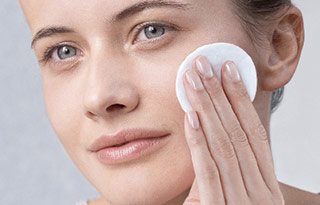 Woman applying Toner